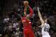 May 14, 2014; San Antonio, TX, USA; Portland Trail Blazers forward LaMarcus Aldridge (12) shoots the ball over San Antonio Spurs forward Tiago Splitter (22) in game five of the second round of the 2014 NBA Playoffs at AT&T Center. Mandatory Credit: Soobum