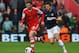 SOUTHAMPTON, ENGLAND - MAY 11: (L-R) Adam Lallana of Southampton holds off Michael Carrick of Manchester United during the Barclays Premier League match between Southampton and Manchester United at St Mary's Stadium on May 11, 2014 in Southampton, Englan