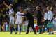 NORWICH, ENGLAND - OCTOBER 06: Manager Jose Mourinho of Chelsea speaks to Eden Hazard of Chelsea during the Barclays Premier League match between Norwich City and Chelsea at Carrow Road on October 6, 2013 in Norwich, England. (Photo by Julian Finney/Gett