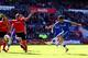 CARDIFF, WALES - MAY 11: Eden Hazard of Chelsea shoots past Steven Caulker of Cardiff City during the Barclays Premier League match between Cardiff City and Chelsea at Cardiff City Stadium on May 11, 2014 in Cardiff, Wales. (Photo by Michael Steele/Gett