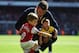 LONDON, ENGLAND - MAY 04: Jack Wilshere of Arsenal with his daughter Delilah and son Archie on the pitch following the Barclays Premier League match between Arsenal and West Bromwich Albion at the Emirates Stadium on May 4, 2014 in London, England. (Pho