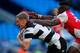 MANCHESTER, ENGLAND - MAY 25: Chris Green (L) of Hull FC dives over to score the winning try in the tackle of Hull KR's Alex Brown during the Super League Magic Weekend match between Hull FC and Hull Kingston Rovers at the Etihad Stadium on May 25, 2013