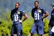 Paul Richardson (left) and Kevin Norwood (right) watch a drill at Seattle's three-day rookie minicamp.
