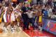 AUBURN HILLS, MI - NOVEMBER 19: Ben Wallace #3 of the Detroit Pistons and teammates are kept apart from Ron Artest #91 of the Indiana Pacers by Pacers head coach Rick Carlisle and official Tommy Nunez Jr. on November 19, 2004 during their game at the Pal