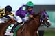 LOUISVILLE, KY - MAY 03: Jockey Victor Espinoza guides California Chrome #5 to the finish line to win the 140th running of the Kentucky Derby at Churchill Downs on May 3, 2014 in Louisville, Kentucky. (Photo by Andy Lyons/Getty Images)