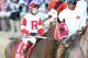LOUISVILLE, KY - MAY 03: Vicar's In Trouble #1, ridden by Rosie Napravnik, takes part in the post parade prior the 140th running of the Kentucky Derby at Churchill Downs on May 3, 2014 in Louisville, Kentucky. (Photo by Matthew Stockman/Getty Images)