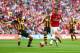 LONDON, ENGLAND - MAY 17: Mesut Oezil of Arsenal takes on Alex Bruce of Hull City during the FA Cup with Budweiser Final match between Arsenal and Hull City at Wembley Stadium on May 17, 2014 in London, England. (Photo by Paul Gilham/Getty Images)