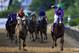 BALTIMORE, MD - MAY 17: California Chrome #3, ridden by Victor Espinoza, crosses the finishline to win the 139th running of the Preakness Stakes at Pimlico Race Course on May 17, 2014 in Baltimore, Maryland. (Photo by Rob Carr/Getty Images)