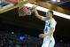 LOS ANGELES, CA - DECEMBER 14: Zach LaVine #14 of the UCLA Bruins dunks in front of Wanaah Bail #1 during a 95-71 win over the Prairie View A&M Panthers at Pauley Pavilion on December 14, 2013 in Los Angeles, California. (Photo by Harry How/Getty Images