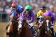 BALTIMORE, MD - MAY 17: California Chrome #3, ridden by Victor Espinoza, races with the field during the 139th running of the Preakness Stakes at Pimlico Race Course on May 17, 2014 in Baltimore, Maryland. (Photo by Matthew Stockman/Getty Images)