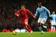 MANCHESTER, ENGLAND - DECEMBER 26: Lucas of Liverpool is closed down by Yaya Toure of Manchester City during the Barclays Premier League match between Manchester City and Liverpool at Etihad Stadium on December 26, 2013 in Manchester, England. (Photo by