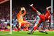 LIVERPOOL, ENGLAND - MAY 11: Daniel Agger of Liverpool (5) shoots past Tim Krul of Newcastle United to score their first goal during the Barclays Premier League match between Liverpool and Newcastle United at Anfield on May 11, 2014 in Liverpool, England