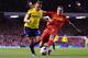 LIVERPOOL, ENGLAND - MARCH 26: Daniel Agger of Liverpool challenges Emanuele Giaccherini of Sunderland during the Barclays Premier League match between Liverpool and Sunderland at Anfield on March 26, 2014 in Liverpool, England. (Photo by Michael Regan/