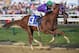 BALTIMORE, MD - MAY 17: California Chrome #3, ridden by Victor Espinoza, races to the finishline to win the 139th running of the Preakness Stakes at Pimlico Race Course on May 17, 2014 in Baltimore, Maryland. (Photo by Molly Riley/Getty Images)