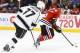 May 18, 2014; Chicago, IL, USA; Chicago Blackhawks right wing Patrick Kane (88) skates with the puck as Los Angeles Kings center Jeff Carter (77) chases in game one of the Western Conference Final of the 2014 Stanley Cup Playoffs at United Center. Mandato