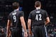 BROOKLYN, NY - March 30: Ricky Rubio #9 and Kevin Love #42 of the Minnesota Timberwolves stand on the court during a game against the Brooklyn Nets on March 30, 2014 at the Barclays Center in Brooklyn, New York. NOTE TO USER: User expressly acknowledges a