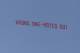 MANCHESTER, ENGLAND - MARCH 29: A plane flies overhead with a banner criticising Manchester United Manager David Moyes during the Barclays Premier League match between Manchester United and Aston Villa at Old Trafford on March 29, 2014 in Manchester, Eng