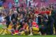 BARCELONA, SPAIN - MAY 17: The players and coaching staff of Club Atletico de Madrid celebrate winning the La Liga after the match between FC Barcelona and Club Atletico de Madrid at Camp Nou on May 17, 2014 in Barcelona, Spain. (Photo by Alex Livesey/G