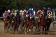 LOUISVILLE, KY - MAY 03: Jockey Victor Espinoza guides California Chrome #5 to the finish line to win the 140th running of the Kentucky Derby at Churchill Downs on May 3, 2014 in Louisville, Kentucky. (Photo by Andy Lyons/Getty Images)