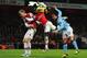 Sagna challenges Carlos Tevez to the shortest aerial duel ever.