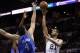 May 19, 2014; San Antonio, TX, USA; San Antonio Spurs forward Tim Duncan (21) shoots the ball over Oklahoma City Thunder forward Nick Collison (4) and center Kendrick Perkins (behind) in game one of the Western Conference Finals in the 2014 NBA Playoffs a