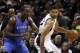 May 19, 2014; San Antonio, TX, USA; San Antonio Spurs forward Tim Duncan (right) posts up against Oklahoma City Thunder center Kendrick Perkins (left) in game one of the Western Conference Finals in the 2014 NBA Playoffs at AT&T Center. Mandatory Credit: