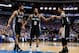 May 2, 2014; Dallas, TX, USA; San Antonio Spurs forward Tim Duncan (21) and forward Kawhi Leonard (2) and guard Danny Green (4) react during the first half against the Dallas Mavericks in game six of the first round of the 2014 NBA Playoffs at American Ai