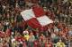 LIVERPOOL, ENGLAND - MAY 3: Liverpool fans in the Kop celebrate after their team defeated Chelsea in the Champions League semi final second leg match between Liverpool and Chelsea at Anfield on May 3, 2005 in Liverpool, England. (Photo by Alex Livesey/G