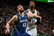 BOSTON, MA - DECEMBER 16: Kevin Love #42 of the Minnesota Timberwolves boxes out Jeff Green #8 of the Boston Celtics on December 16, 2013 at the TD Garden in Boston, Massachusetts. NOTE TO USER: User expressly acknowledges and agrees that, by downloading