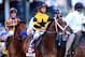 LOUISVILLE, KY - MAY 03: Commanding Curve #17, ridden by Shaun Bridgmohan, takes part in the post parade prior the 140th running of the Kentucky Derby at Churchill Downs on May 3, 2014 in Louisville, Kentucky. (Photo by Rob Carr/Getty Images)