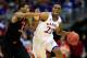 KANSAS CITY, MO - MARCH 13: Andrew Wiggins #22 of the Kansas Jayhawks drives upcourt as Marcus Smart #33 of the Oklahoma State Cowboys defends during the Big 12 Basketball Tournament quarterfinal game at Sprint Center on March 13, 2014 in Kansas City, Mi