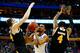 BUFFALO, NY - MARCH 20: Darrun Hilliard II #4 of the Villanova Wildcats goes to the basket as Austin Arians #34 and Malcolm Moore #4 of the Milwaukee Panthers defend during the second round of the 2014 NCAA Men's Basketball Tournament at the First Niagar