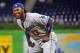 May 2, 2014; Miami, FL, USA; Los Angeles Dodgers shortstop Hanley Ramirez (13) stretches prior to a game against the Miami Marlins at Marlins Ballpark. Mandatory Credit: Steve Mitchell-USA TODAY Sports