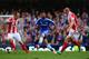 LONDON, ENGLAND - APRIL 05: Ashley Cole of Chelsea is closed down by Charlie Adam of Stoke City and Andy Wilkinson of Stoke City during the Barclays Premier League match between Chelsea and Stoke City at Stamford Bridge on April 5, 2014 in London, Englan