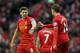 LIVERPOOL, ENGLAND - FEBRUARY 23: Jordan Henderson of Liverpool celebrates scoring his team's fourth goal with his team-mate Steven Gerrard during the Barclays Premier League match between Liverpool and Swansea City at Anfield on February 23, 2014 in Liv