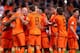 AMSTERDAM, NETHERLANDS - OCTOBER 11: Arjen Robben of Holland (3rd L) celebrates with Robin van Persie (2nd L) during the FIFA 2014 World Cup Qualifing match between Holland and Hungary at Amsterdam Arena on October 11, 2013 in Amsterdam, Netherlands. (P