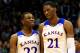 LAWRENCE, KS - NOVEMBER 22: Andrew Wiggins #22 of the Kansas Jayhawks talks with Joel Embiid #21 as they walk onto the floor after a timeout during the game against the Towson Tigers at Allen Fieldhouse on November 22, 2013 in Lawrence, Kansas. (Photo by