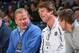 Brian Kelly sits with new assistant coaches Brian VanGorder and Matt LaFleur at an Irish basketball game.