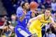 Mar 30, 2014; Indianapolis, IN, USA; Kentucky Wildcats guard/forward James Young (1) passes the ball away from Michigan Wolverines guard Nik Stauskas (11) in the second half of the finals of the midwest regional of the 2014 NCAA Mens Basketball Championsh