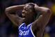 INDIANAPOLIS, IN - MARCH 30: Julius Randle #30 of the Kentucky Wildcats celebrates after defeating the Michigan Wolverines 75 to 72 in the midwest regional final of the 2014 NCAA Men's Basketball Tournament at Lucas Oil Stadium on March 30, 2014 in India