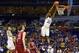 Mar 21, 2014; St. Louis, MO, USA; Kansas Jayhawks guard Andrew Wiggins (22) dunks the ball past Eastern Kentucky Colonels guard Marcus Lewis (12) in the first half during the 2nd round of the 2014 NCAA Men's Basketball Championship at Scottrade Center. M