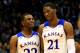 LAWRENCE, KS - NOVEMBER 22: Andrew Wiggins #22 of the Kansas Jayhawks talks with Joel Embiid #21 as they walk onto the floor after a timeout during the game against the Towson Tigers at Allen Fieldhouse on November 22, 2013 in Lawrence, Kansas. (Photo by