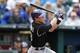 KANSAS CITY, MO - MAY 14: Drew Stubbs #13 of the Colorado Rockies hits a two-run home run in the seventh inning against the Kansas City Royals at Kauffman Stadium on May 14, 2014 in Kansas City, Missouri. (Photo by Ed Zurga/Getty Images)