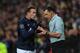 CARDIFF, WALES - NOVEMBER 24: Manchester United player Wayne Rooney (l) makes a point to referee Neil Swarbrick after being booked during the Barclays Premier League match between Cardiff City and Manchester United at Cardiff City Stadium on November 24,