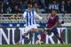 SAN SEBASTIAN, SPAIN - FEBRUARY 12: Dani Alves of FC Barcelona duels for the ball with Antoine Griezmann of Real Sociedad during the Copa del Rey Semi-Final first leg match between Real Sociedad and Barcelona at Estadio Anoeta on February 12, 2014 in Sa