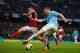 MANCHESTER, ENGLAND - MARCH 22: Patrick Roberts of Fulham goes into block the cross from James Milner of Manchester City lduring the Barclays Premier League match between Manchester City and Fulham at Etihad Stadium on March 22, 2014 in Manchester, Engla