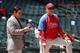 PHOENIX, AZ - APRIL 27: General manager Ruben Amaro and manager Ryne Sandberg of the Philadelphia Phillies watch bating practice before the MLB game against the Arizona Diamondbacks at Chase Field on April 27, 2014 in Phoenix, Arizona. The Phillies defea
