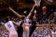 DURHAM, NC - FEBRUARY 04: Miles Overton #20 of the Wake Forest Demon Deacons drives between defenders Jabari Parker #1 and Josh Hairston #15 of the Duke Blue Devils during their game at Cameron Indoor Stadium on February 4, 2014 in Durham, North Carolina