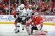 CHICAGO, IL - MAY 18: Mike Richards #10 of the Los Angeles Kings waits for the puck in front of goalie Corey Crawford #50 of the Chicago Blackhawks as teammate Justin Williams #14 watches from behind in Game One of the Western Conference Final during the