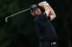 VIRGINIA WATER, ENGLAND - MAY 22: Thomas Bjorn of Denmark hits an approach shot during day one of the BMW PGA Championship at Wentworth on May 22, 2014 in Virginia Water, England. (Photo by David Cannon/Getty Images)